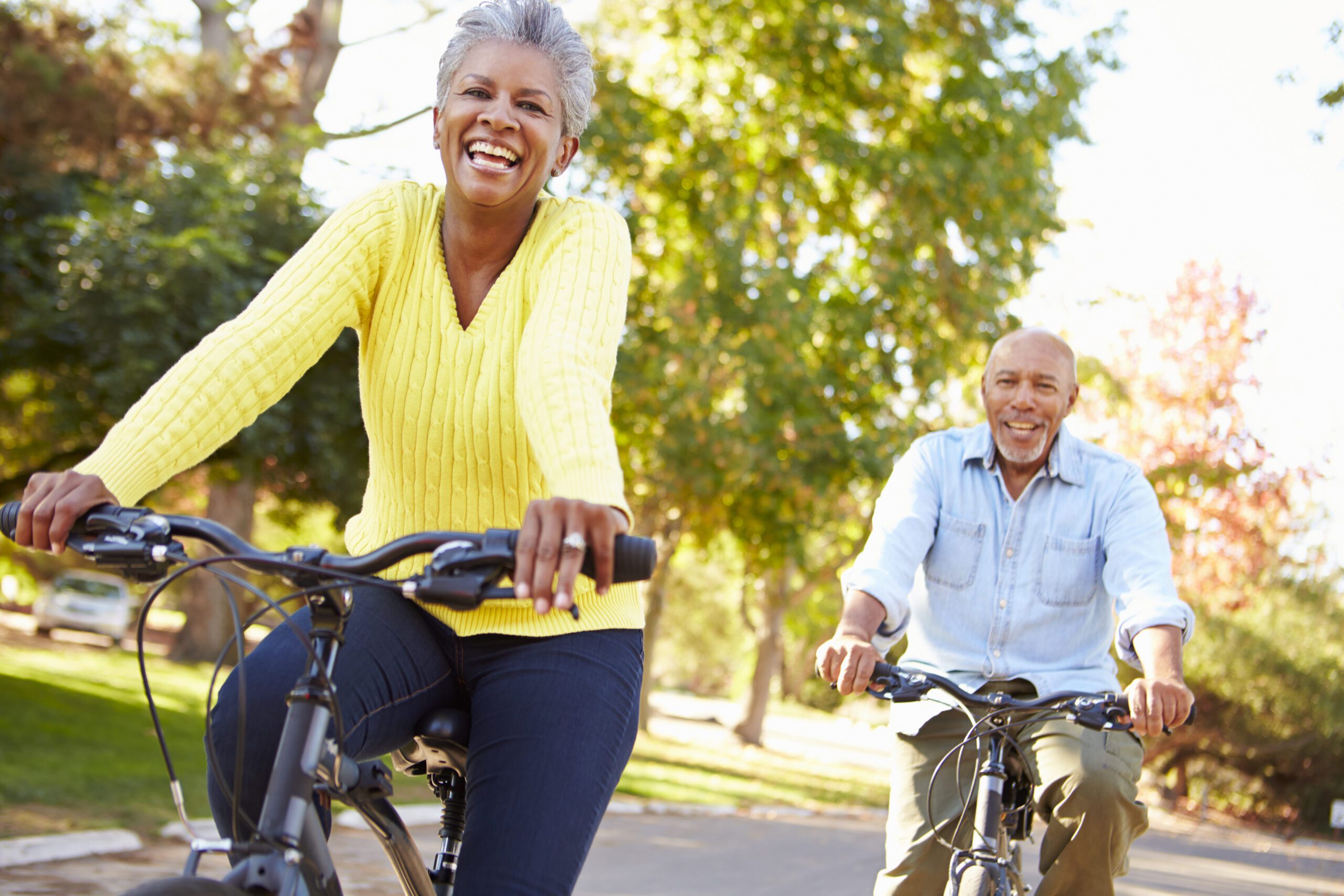 Senior Couple On Cycle Ride In Countryside