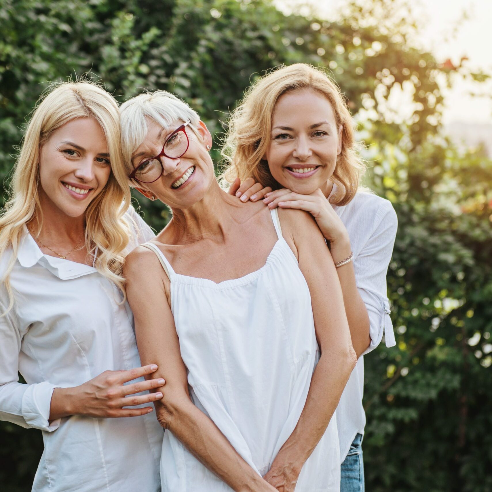 Three women enjoying outdoors, talking and laughing